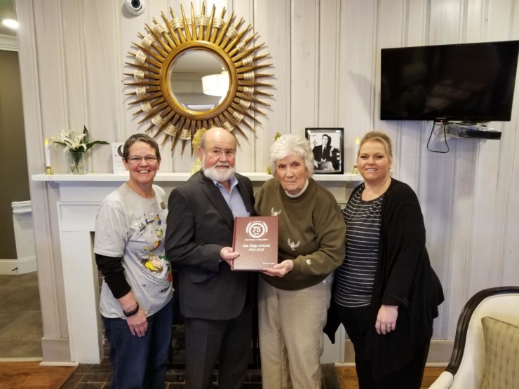 Pictured above at the Alexander Guest House are, from left, LuAnn Hanchett, community relations and activity director; MCLinc President Barry Stephenson; resident Muriel Bogardus; and Executive Director Amy Duncan. (Submitted photo)